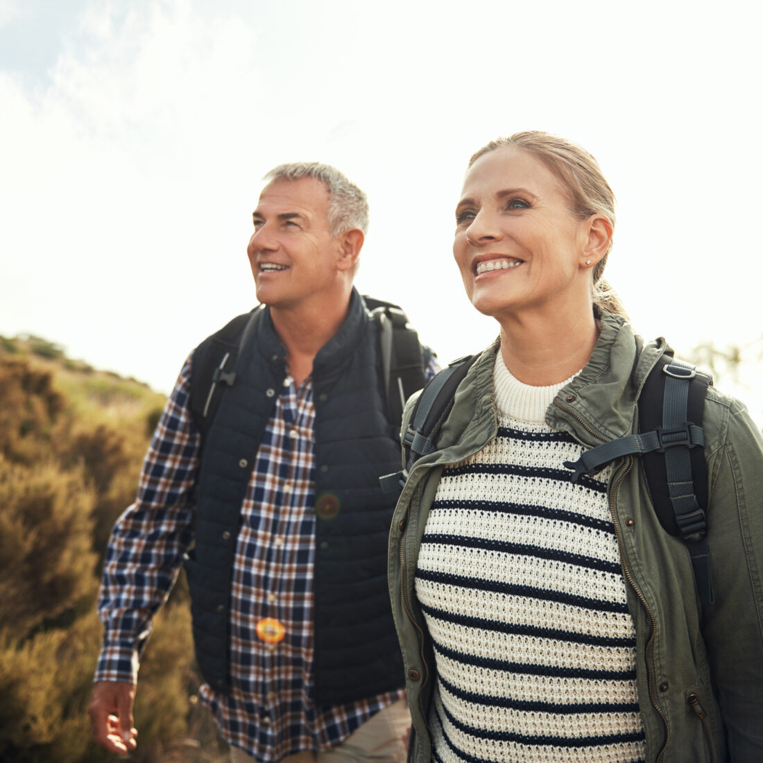 Shot of a mature couple hiking through the mountains